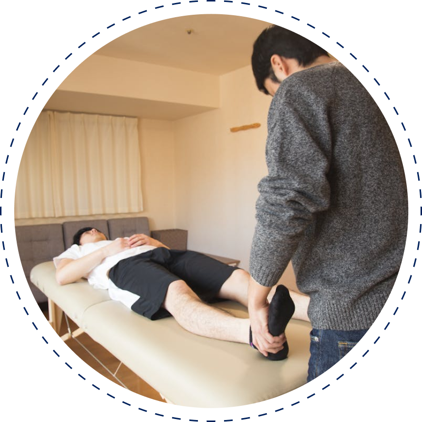 A person is getting their leg examined by an osteopath.